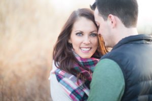 smiling couple with blanket scarf