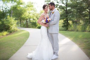 bride and groom on sidewalk