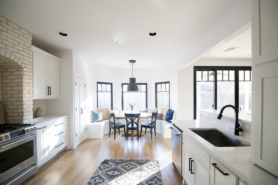 Tulsa Remodel Reveal Modern White Farmhouse black windows and doors black windows and doors built in window seat banquette dining room black pendant lighting-1-3