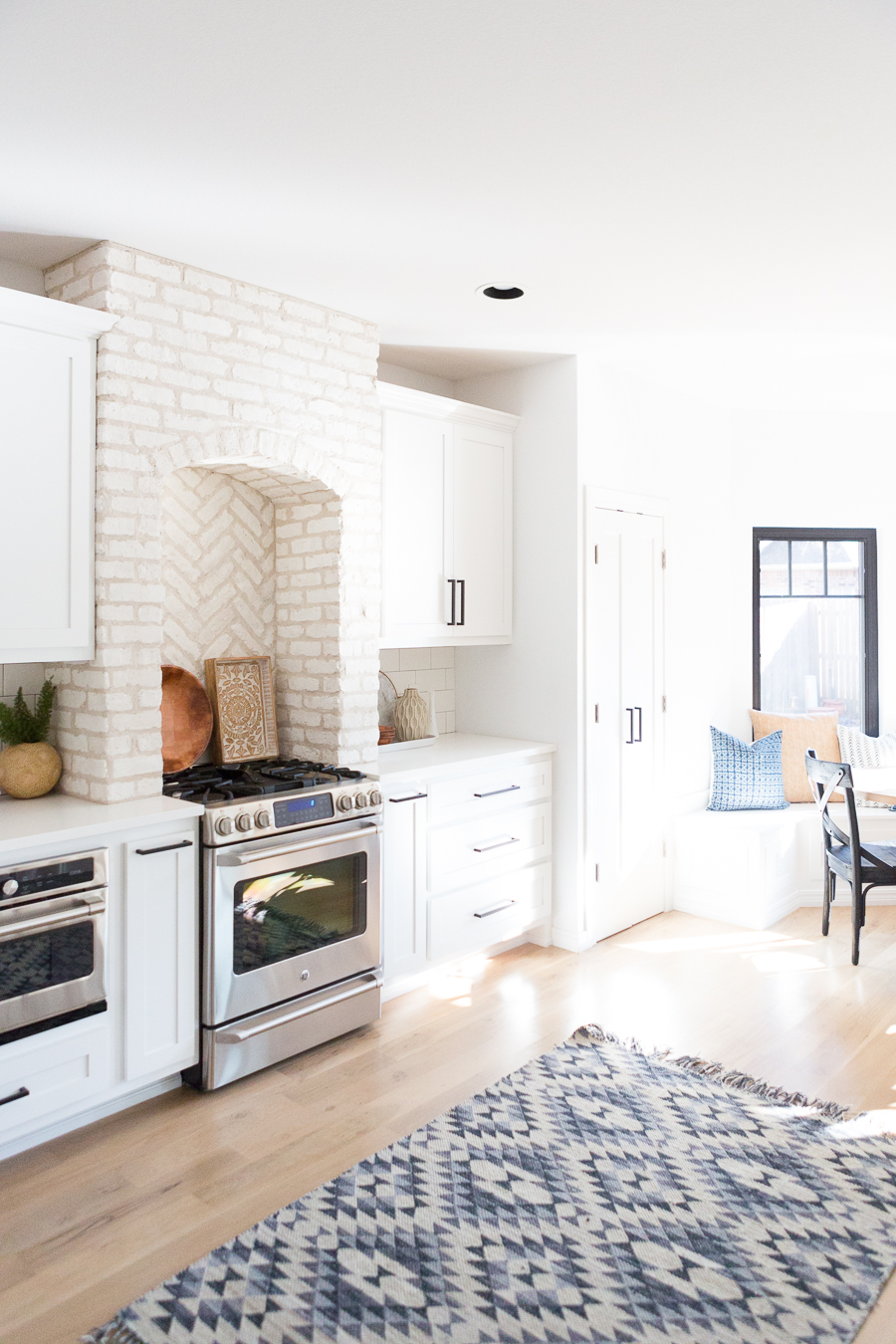 Tulsa Remodel Reveal Modern White Farmhouse black windows and doors white brick kitchen black hardware-1-2