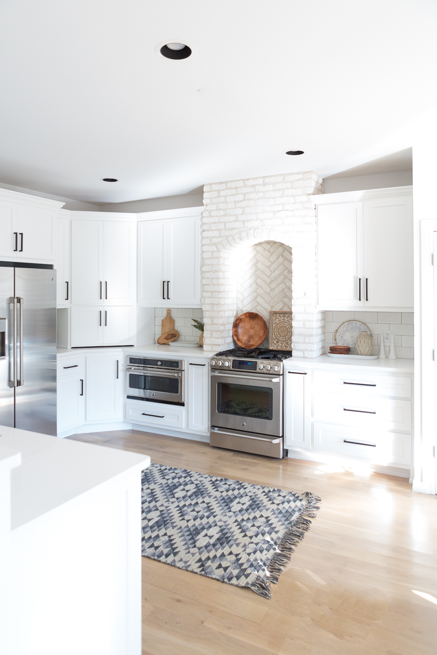 Tulsa Remodel Reveal Modern White Farmhouse black windows and doors white brick kitchen black hardware-1