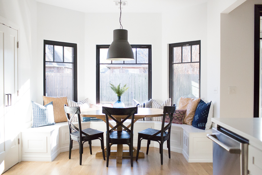 How to Design a Beautiful Kitchen Banquette modern farmhouse black dining room chairs oval wood pedestal table IKEA Hektar black pendant black windows-1-3