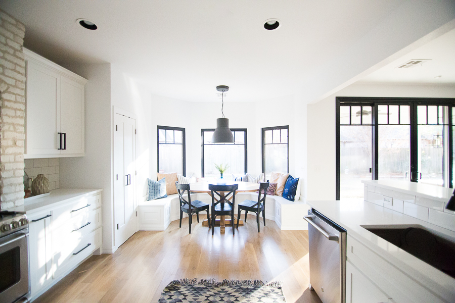 How to Design a Beautiful Kitchen Banquette modern farmhouse black dining room chairs oval wood pedestal table IKEA Hektar black pendant black windows-1-3