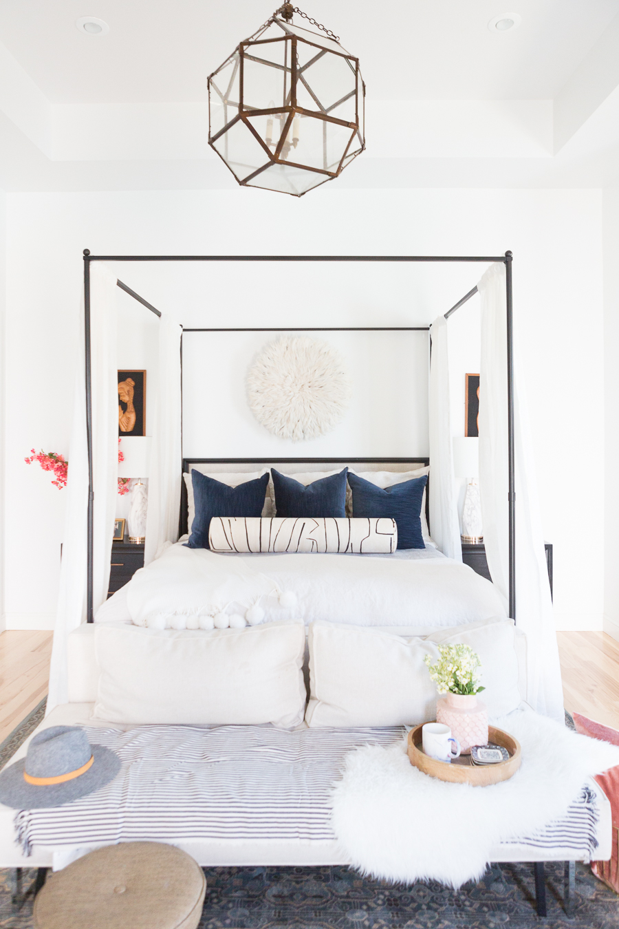 The Ultimate Guide to Affordable Canopy Beds master bedroom end of bed sofa navy and black master bedroom decor black wood master bedroom night stands gallery art master bedroom black gallery frames master bedroom fiddle leaf fig tree master bedroom juju hat over bed pink faux stems