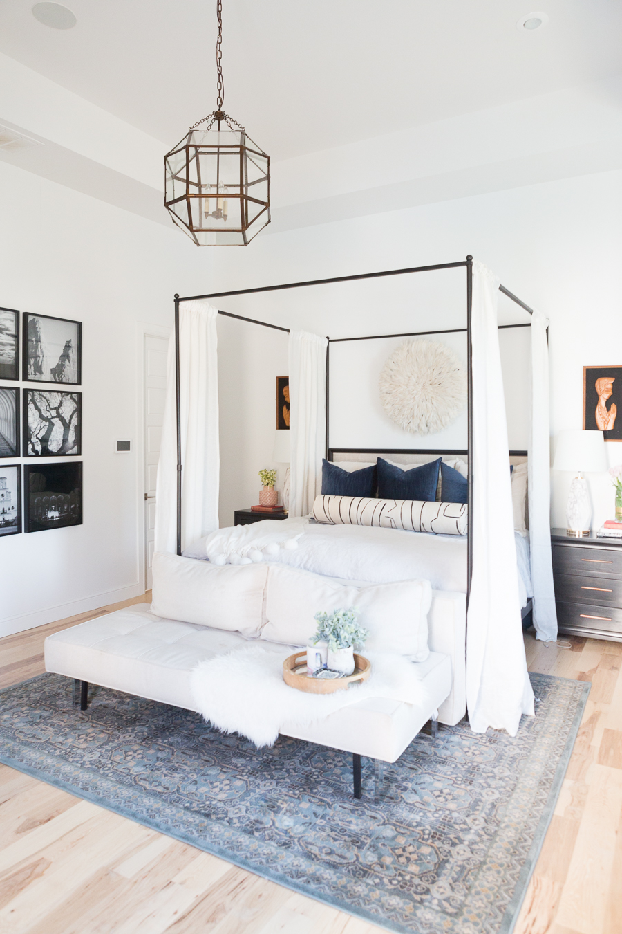 The Ultimate Guide to Affordable Canopy Beds master bedroom end of bed sofa navy and black master bedroom decor black wood master bedroom night stands gallery art master bedroom black gallery frames master bedroom fiddle leaf fig tree master bedroom juju hat over bed pink faux stems