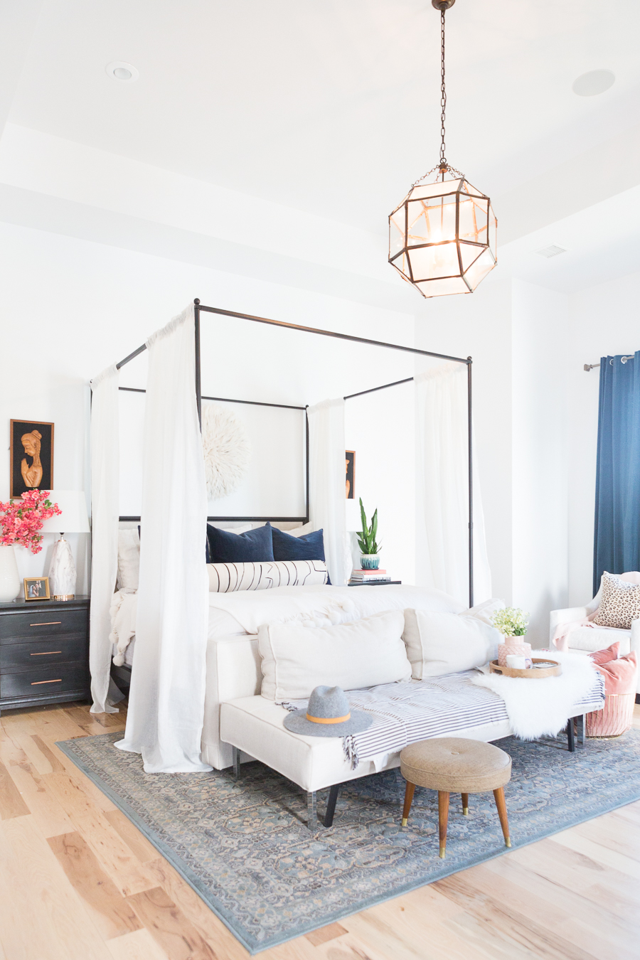 The Ultimate Guide to Affordable Canopy Beds master bedroom end of bed sofa navy and black master bedroom decor black wood master bedroom night stands gallery art master bedroom black gallery frames master bedroom fiddle leaf fig tree master bedroom juju hat over bed pink faux stems