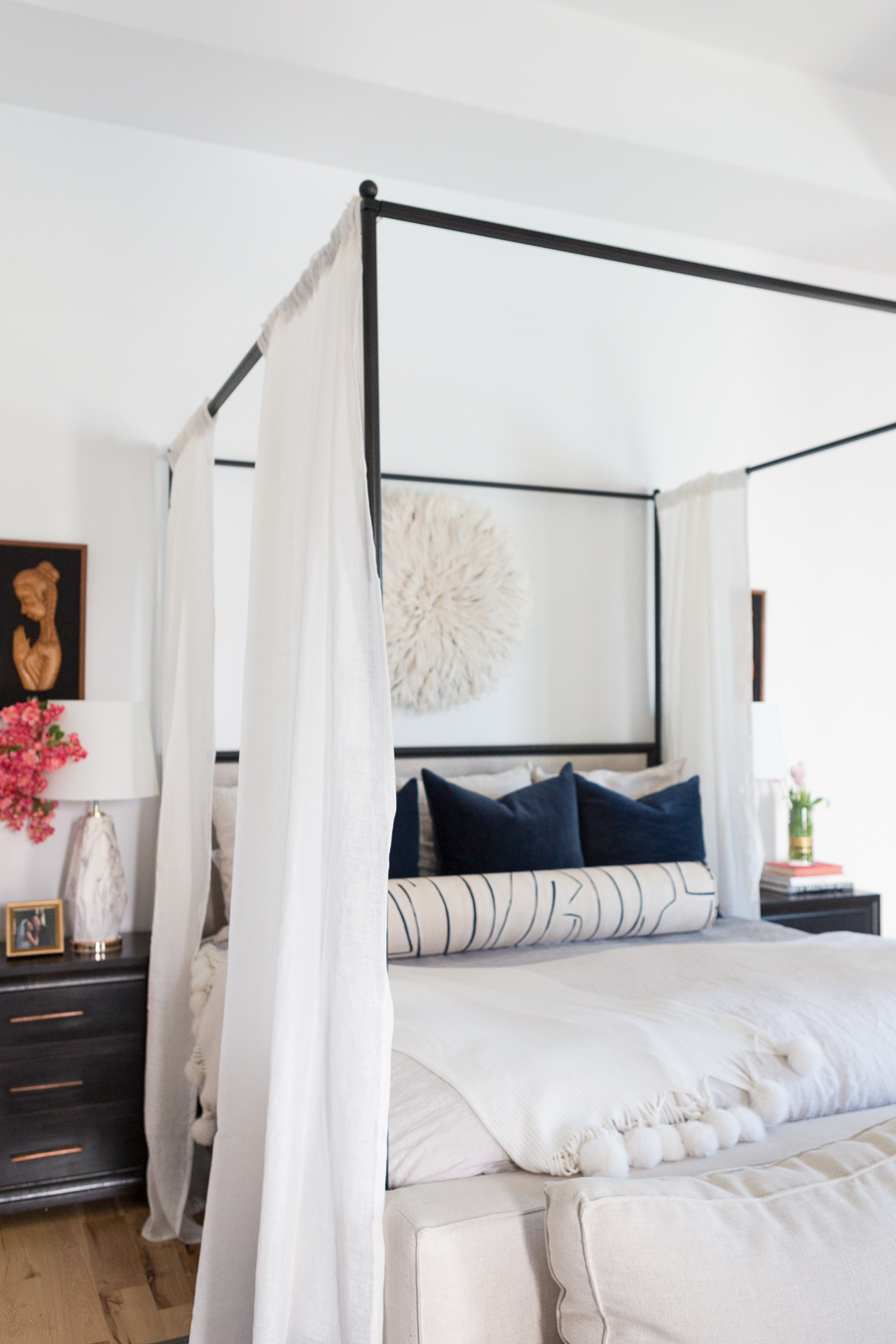 The Ultimate Guide to Affordable Canopy Beds master bedroom end of bed sofa navy and black master bedroom decor black wood master bedroom night stands gallery art master bedroom black gallery frames master bedroom fiddle leaf fig tree master bedroom juju hat over bed pink faux stems