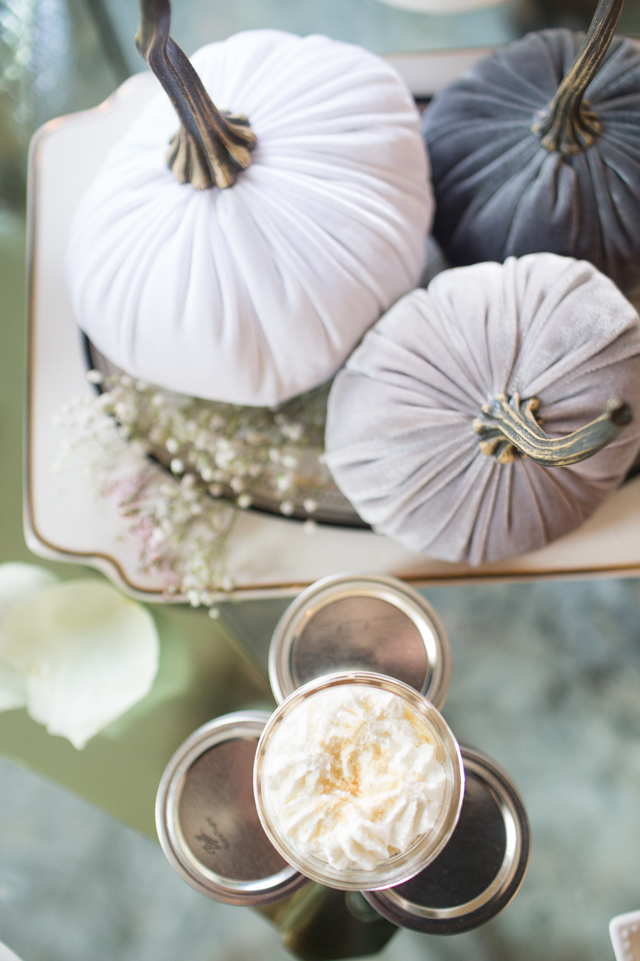 Beautiful Fall Bridal Shower Ideas fall bridal shower cake on a white cake stand surrounded by velvet pumpkins and hydrangeas velvet pumpkins on a cake plate surrounded by baby's breath with mini key lime pies