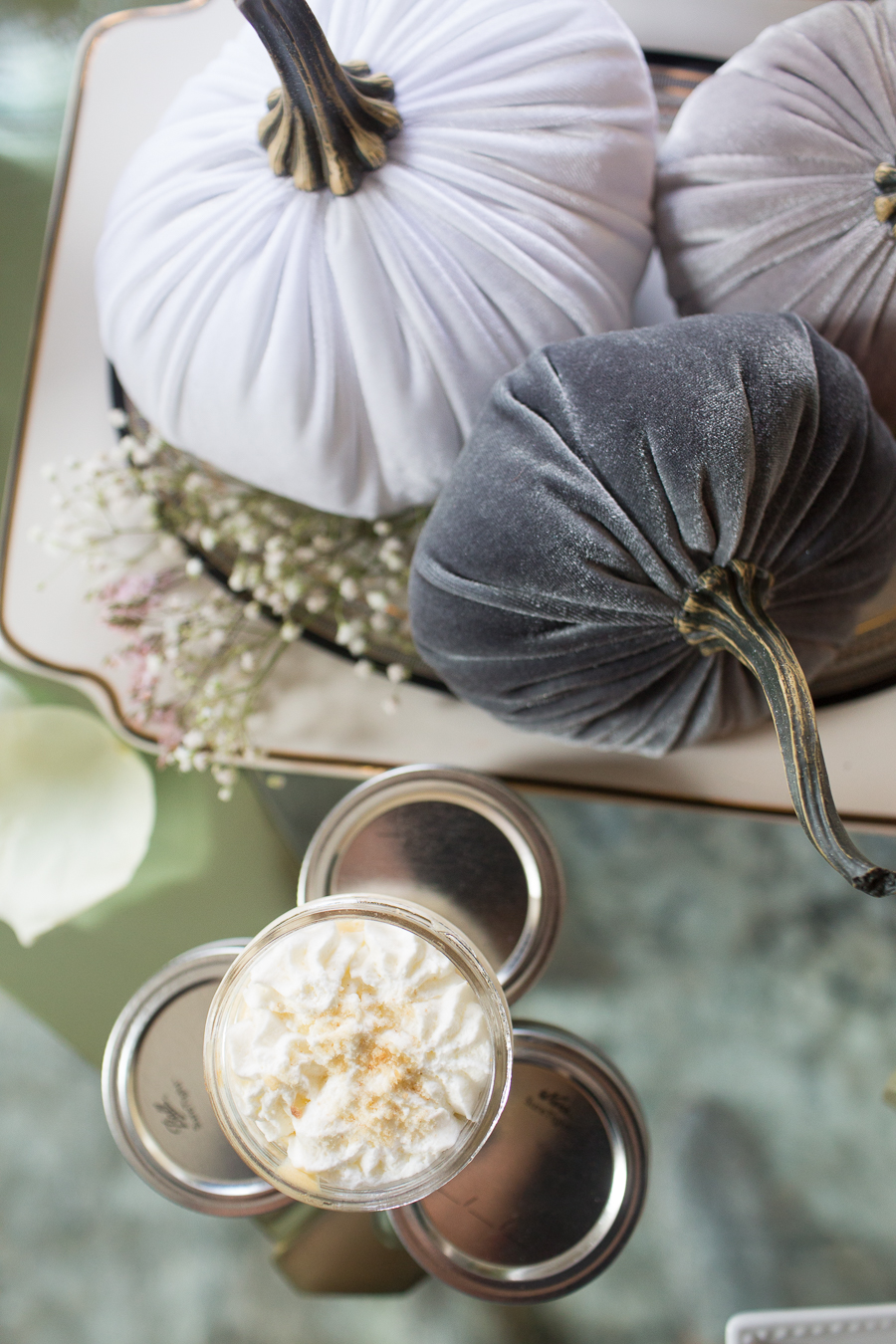 Beautiful Fall Bridal Shower Ideas fall bridal shower cake on a white cake stand surrounded by velvet pumpkins and hydrangeas velvet pumpkins on a cake plate surrounded by baby's breath with mini key lime pies