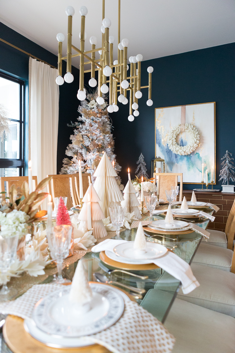 Budget Friendly Holiday Decor from Walmart Christmas tablescape with gold candlesticks and floral arrangements in a hexagon gold vase from West Elm