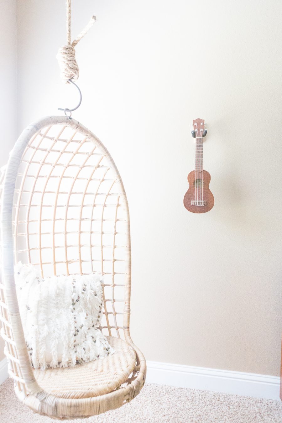 TEEN HANGOUT ROOM DESIGN PLAN AND HANGING CHAIRS with hanging chair and a fluffy white sequined pillow and a guitar hanging on the wall 