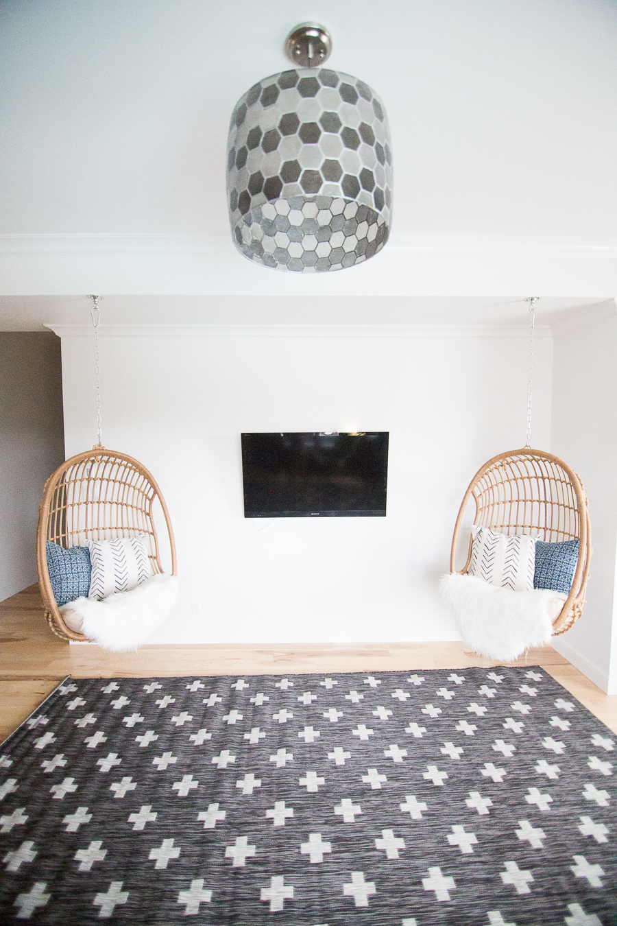 TEEN HANGOUT ROOM DESIGN PLAN AND HANGING CHAIRS shown hanging next to one another with hexagon shaped light fixture and plus sign rug