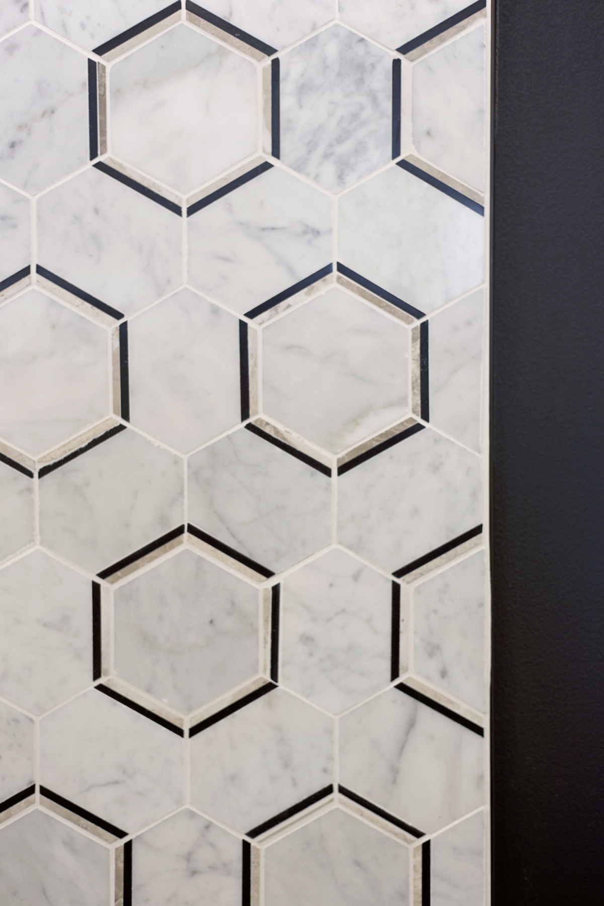 elite dance studio hexagon tiling behind front desk