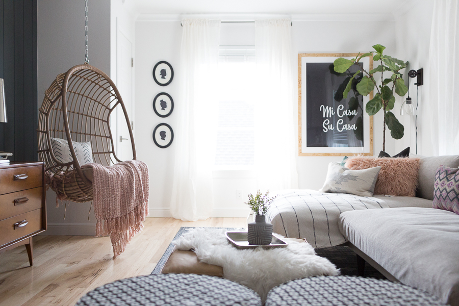 CC and Mike Teen Hangout Room Reveal with Joybird Sectional woven hanging chair in a room white white walls mi casa su casa framed art hanging on the wall next to a fiddle leaf fig tree in a basket