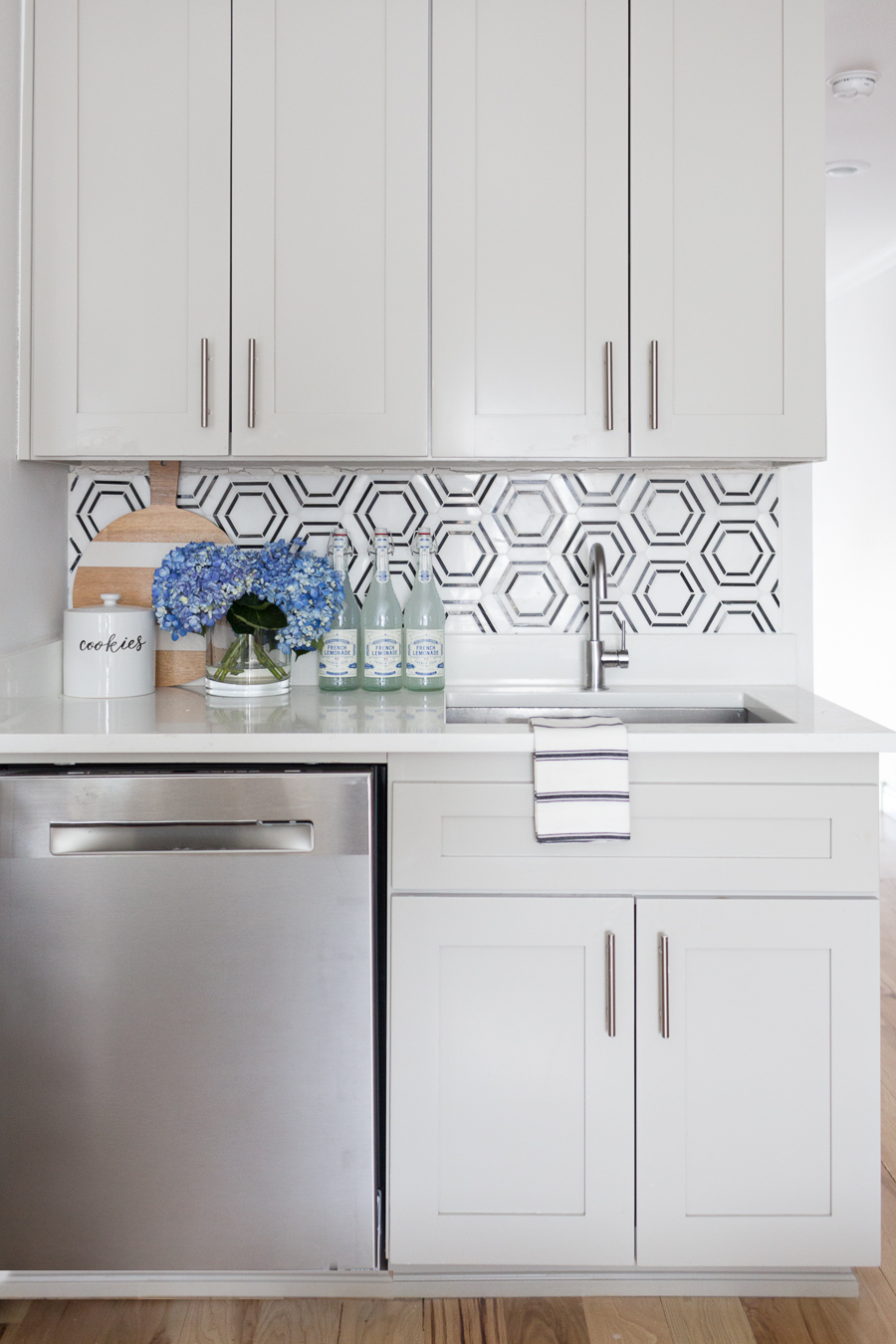 CC and Mike Teen Hangout Room Reveal with Joybird Sectional black and white marble hexagon with gray kitchen cabinets and silver hardware