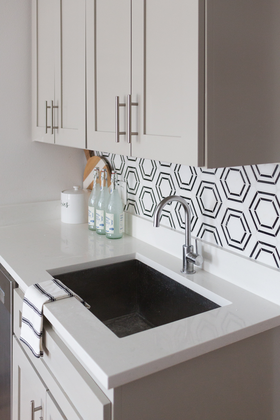 CC and Mike Teen Hangout Room Reveal with Joybird Sectional gray cabinets with black and white marble hexagon tile backsplash