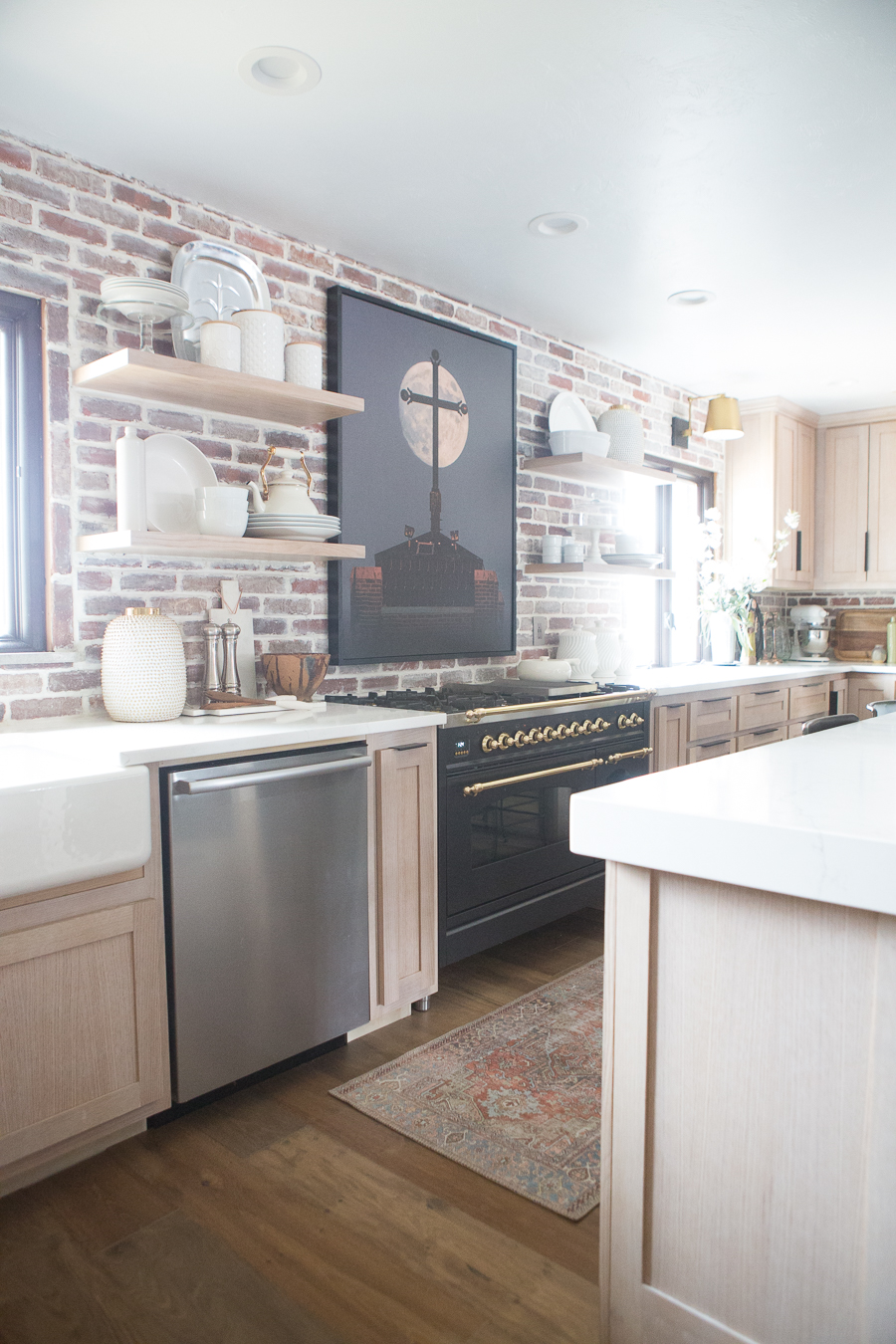 the kane project kitchen with brick featured wall