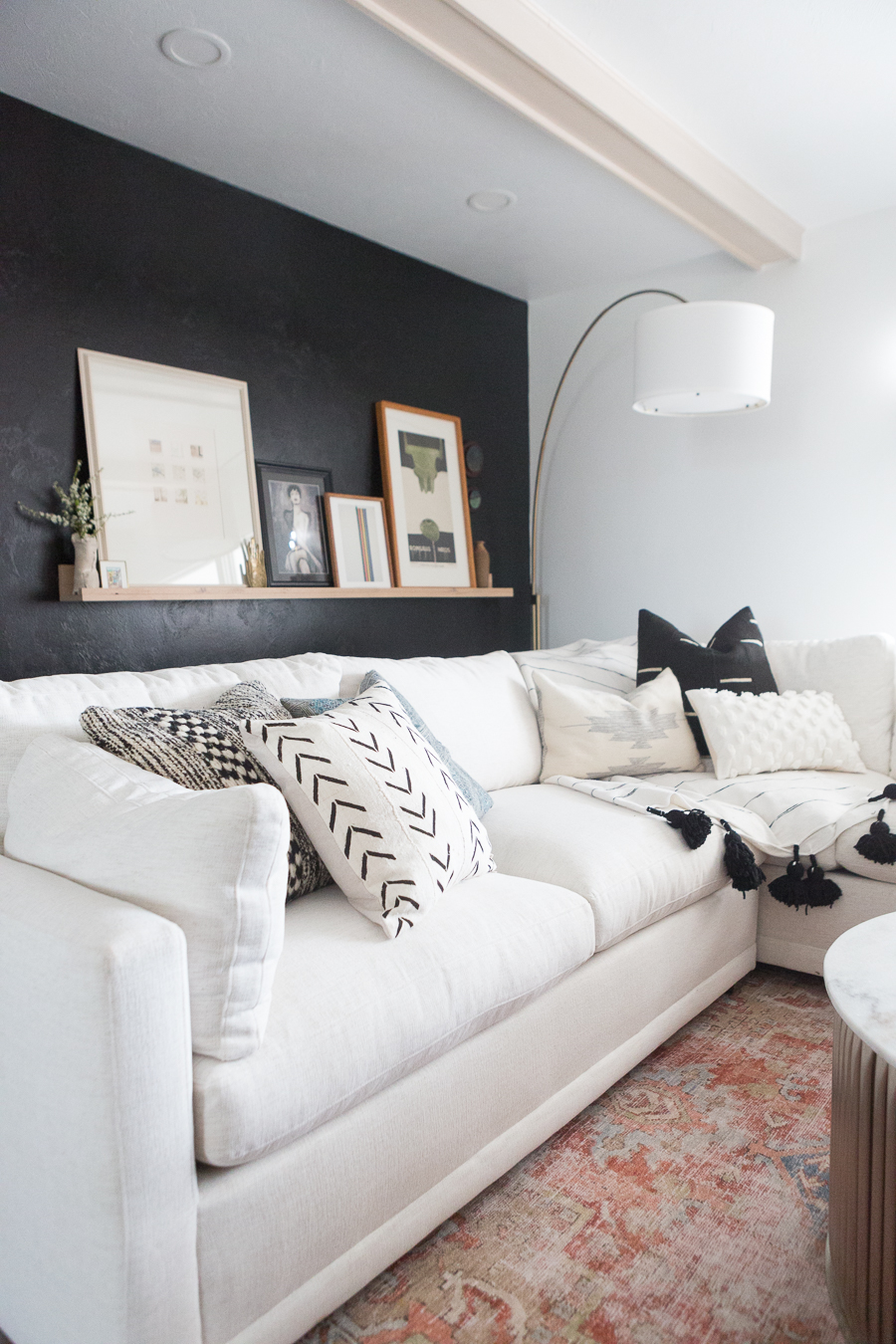 the kane project white wrap around couch in living room