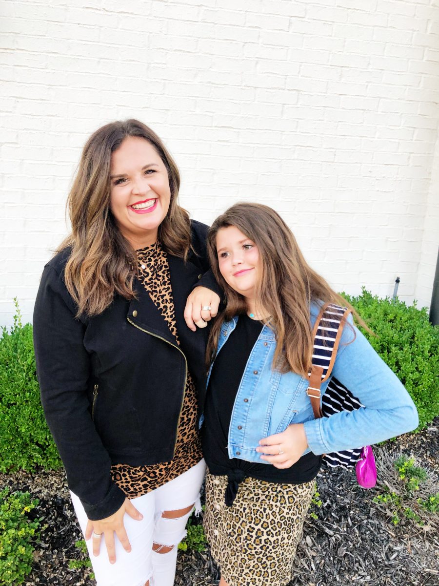 Back-To-School-with-Walmart-Part-Two-mother-and-daughter-in-leopard-shirt-and-skirt-with-jean-jackets-from-Walmart-in-front-of-a-white-brick-wall6