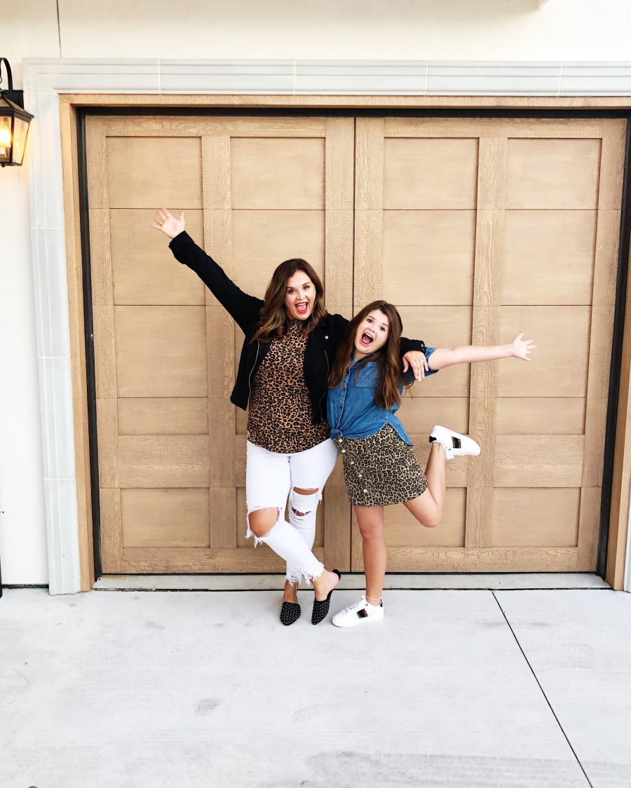 Back-To-School-with-Walmart-Part-Two-mother-and-daughter-in-leopard-shirt-and-skirt-with-jean-jackets-from-Walmart-in-front-of-a-white-brick-wall6