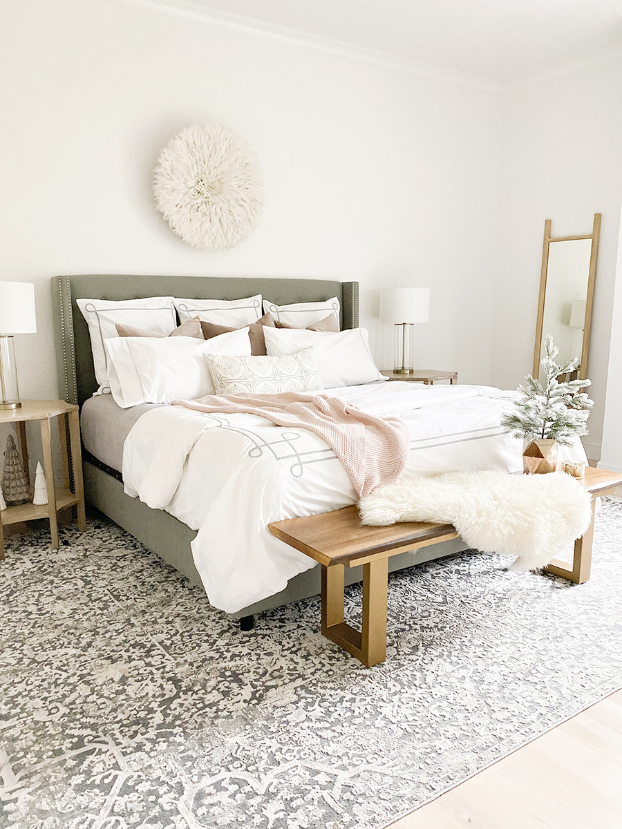 How to Get Your Guest Bedroom Holiday Ready Serena and Lliy Bedding Gray upholstered bed with wood bench and juju hat