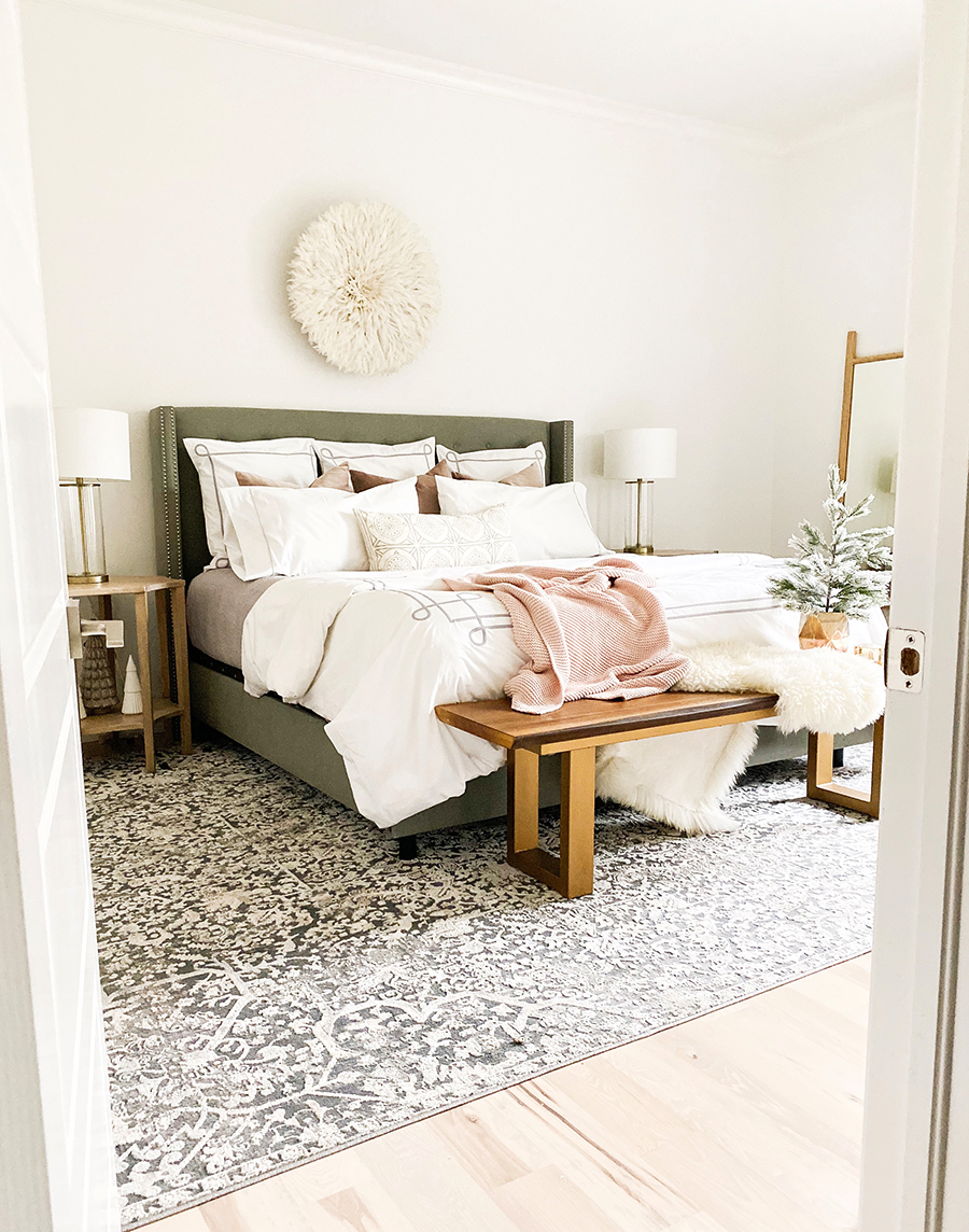 How to Get Your Guest Bedroom Holiday Ready Serena and Lliy Bedding Gray upholstered bed with wood bench and juju hat