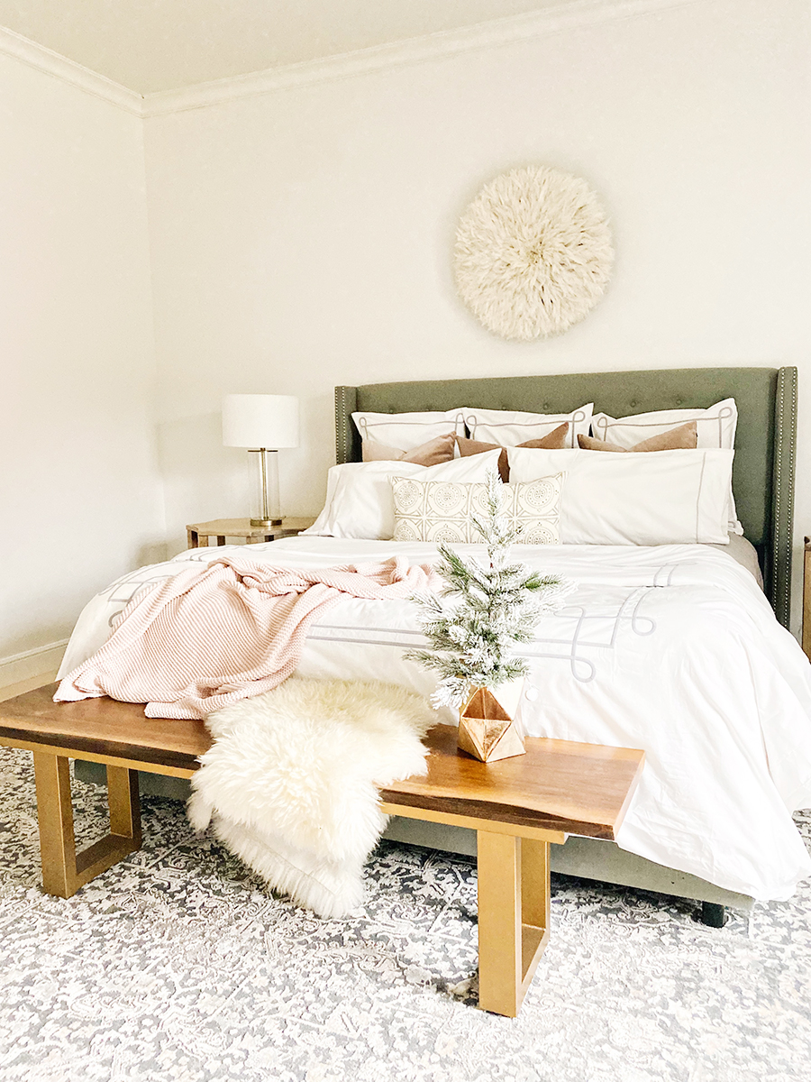 How to Get Your Guest Bedroom Holiday Ready Serena and Lliy Bedding Gray upholstered bed with wood bench and juju hat