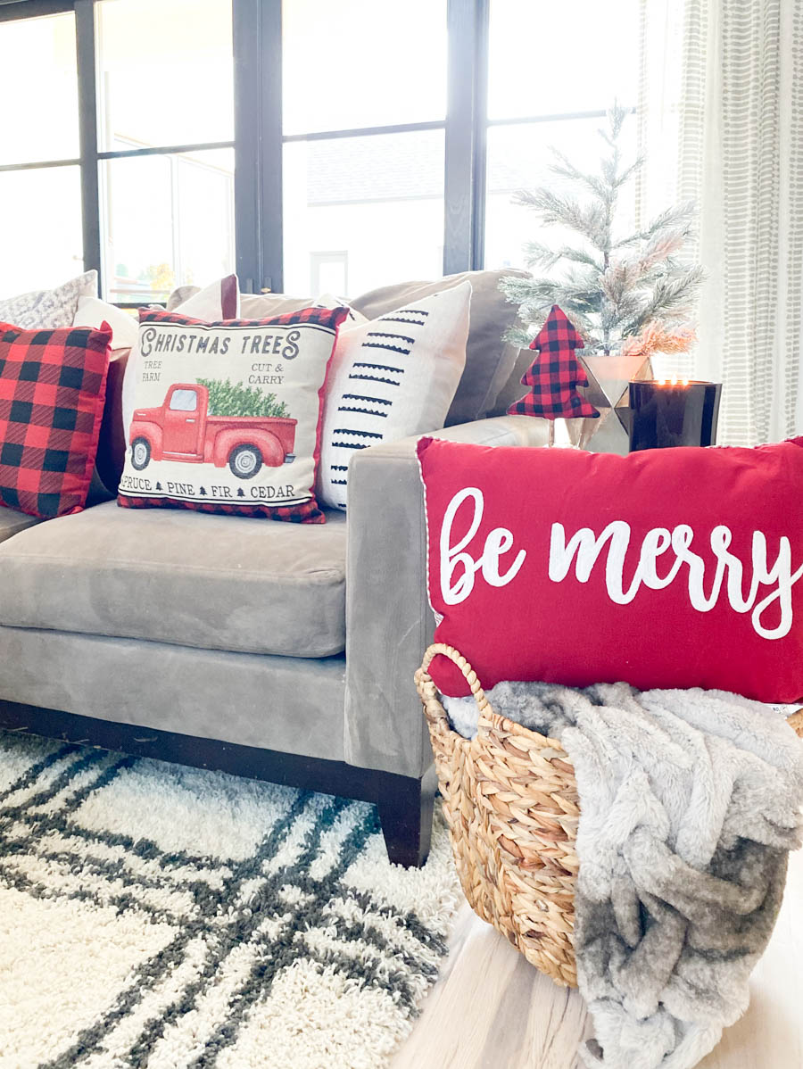 Affordable Buffalo Plaid Holiday Pillows and Decor buffalo plaid pillows and tabletop Christmas trees on a round wood coffee table-2