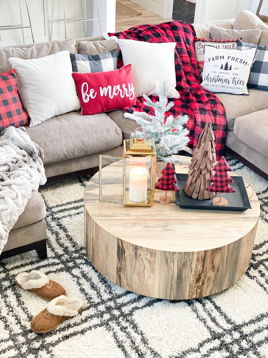 Affordable Buffalo Plaid Holiday Pillows and Decor buffalo plaid pillows and tabletop Christmas trees on a round wood coffee table-2