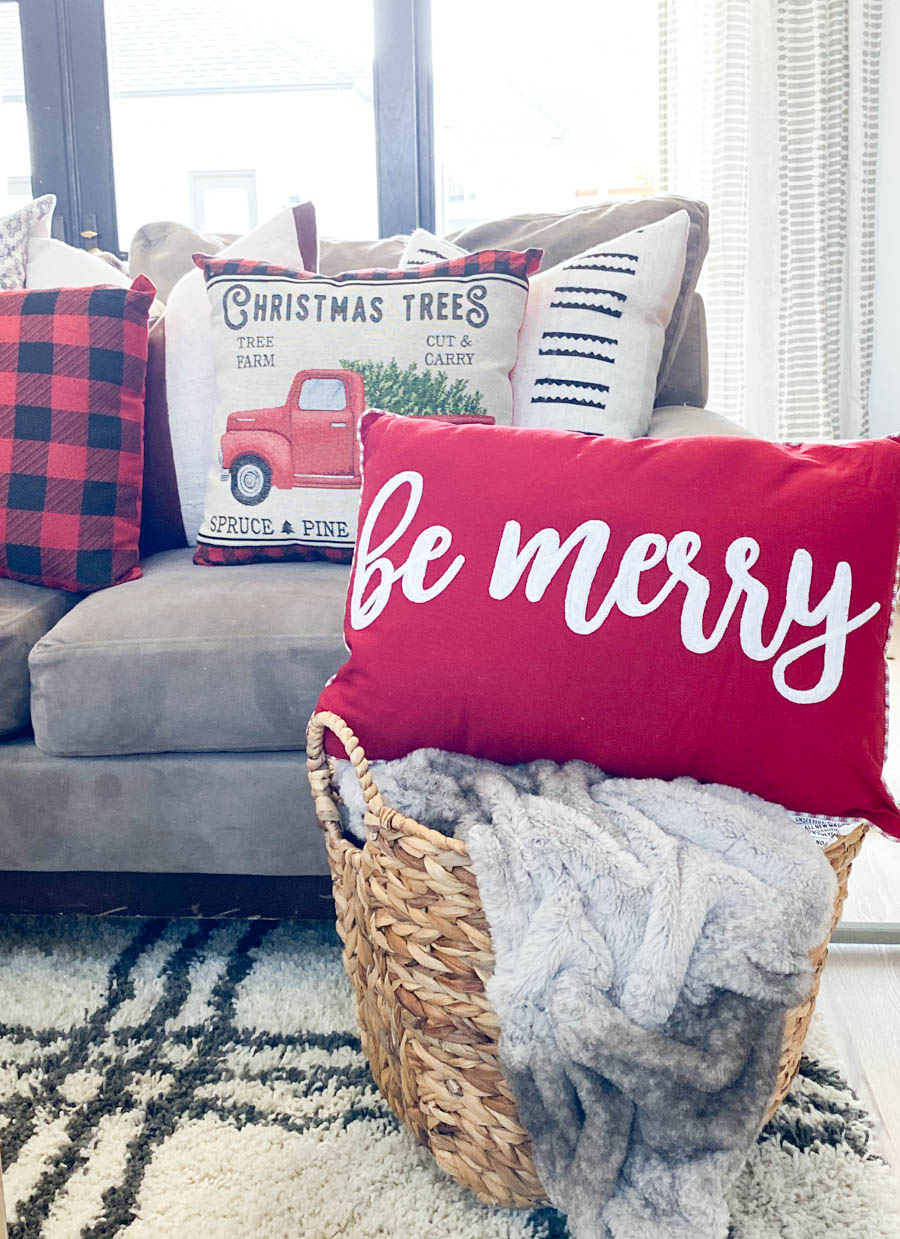 Affordable Buffalo Plaid Holiday Pillows and Decor buffalo plaid pillows and tabletop Christmas trees on a round wood coffee table-2