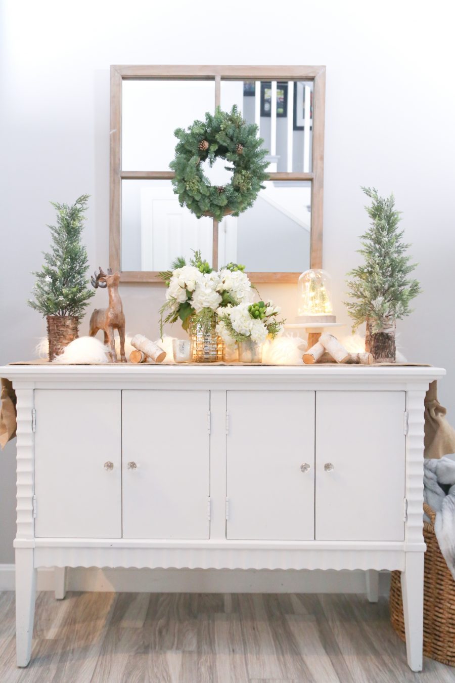 Black Friday and Cyber Monday Sales from Wayfair White console table with pine trees and reindeer and white hydrangea