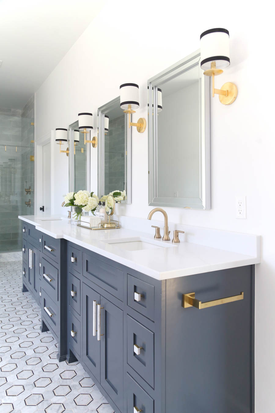 CC and Mike Frisco I Project Reveal-5 black marble hexagon floors with gray cabinets and marble and gold hardware
