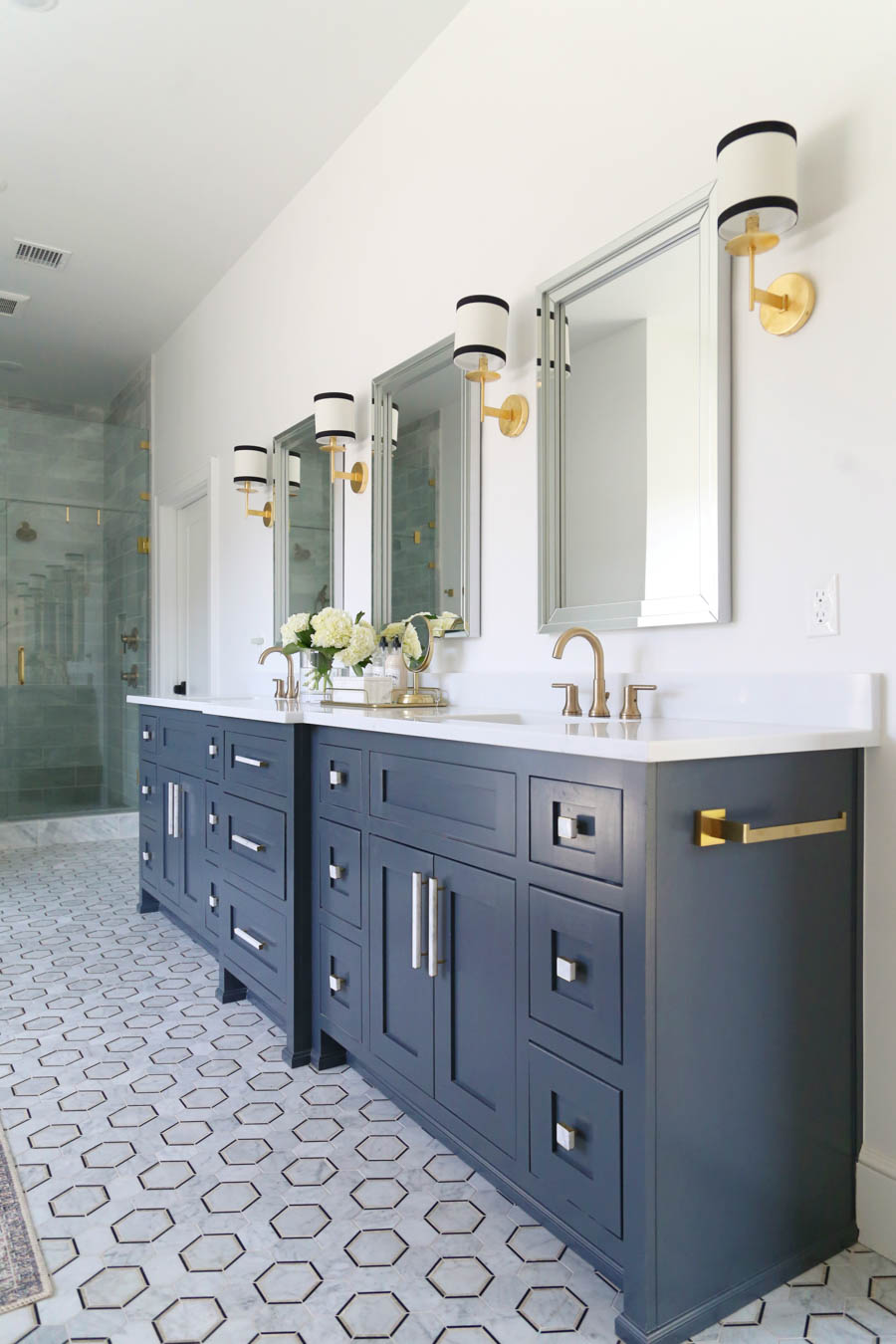 CC and Mike Frisco I Project Reveal-5 black marble hexagon floors with gray cabinets and marble and gold hardware