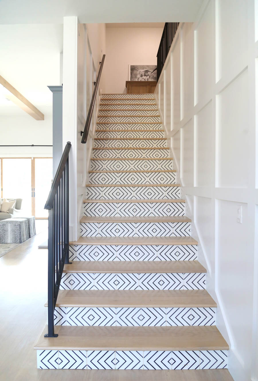 Cc And Mike Frisco I Project Reveal 32 Black And White Ceramic Patterned Tile On Wood Stair Case With Black Railing And White Wood Paneling Cc Mike