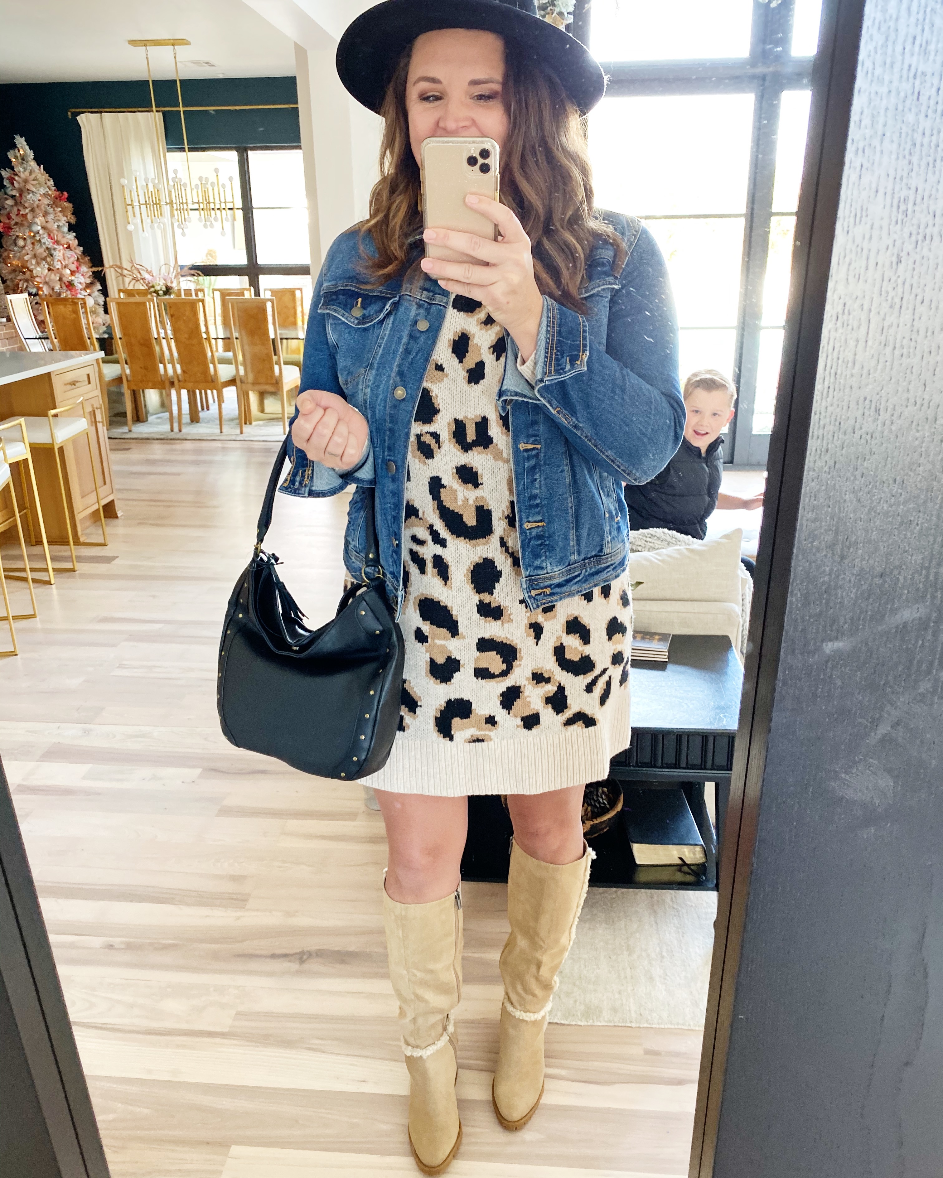 How to Style 20 Walmart Fashion Items 20 Ways leopard sweater dress with tall boots and a jean jacket