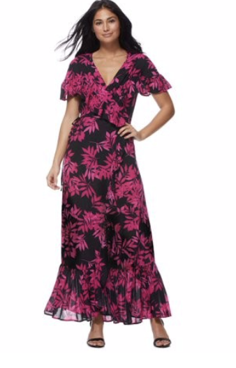 15 Must Have Walmart Fashion Items for Spring Carissa Miller standing by a rectangular pool with hot tub and black and white umbrella in a black and pink palm print wrap dress by Sofia Vergara Walmart