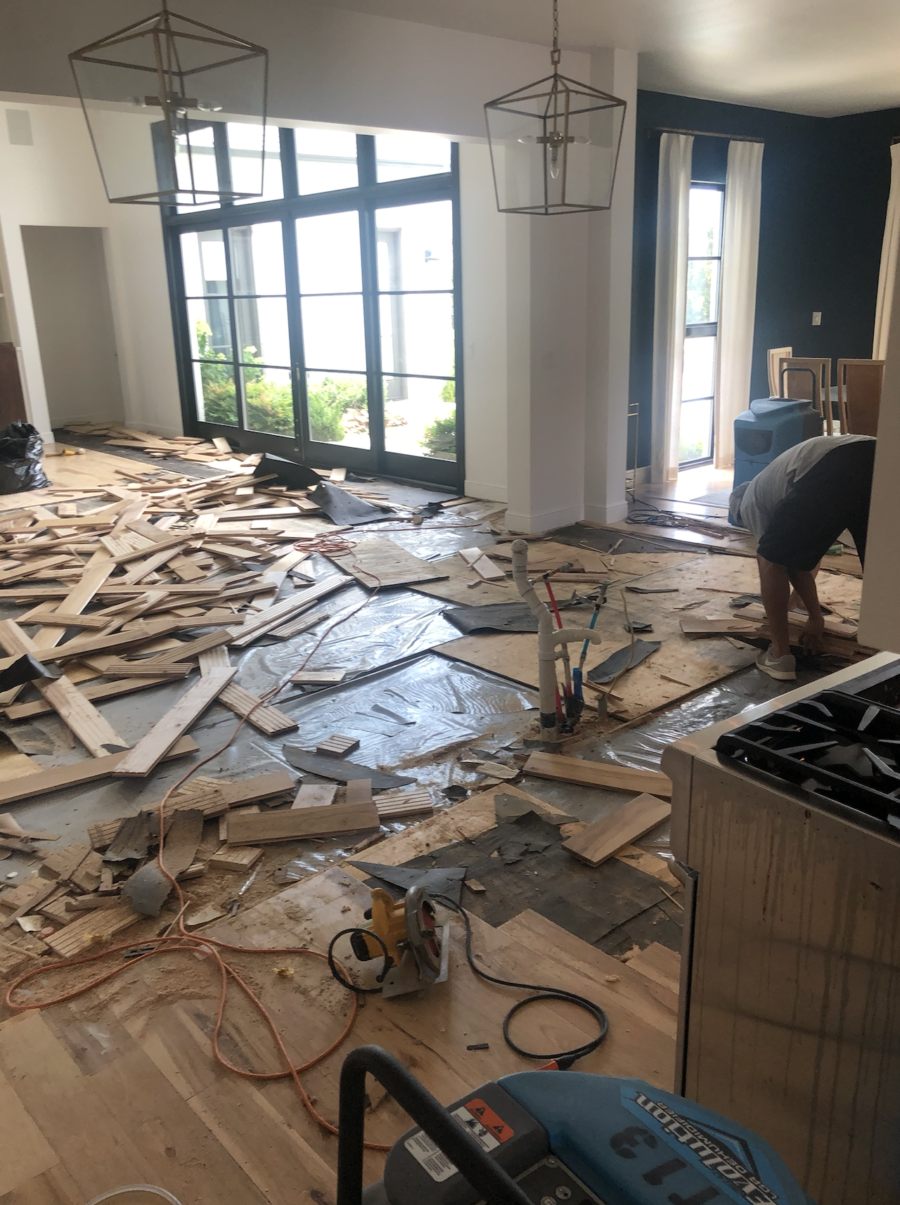 CC and MIke Kitchen Remodel Reveal large natural wood island with quartz countertops and gold bar stools black and gold pendants Ann sacks patterned backsplash gold Brizo faucet large Kallista stainless steel sink open floorpan