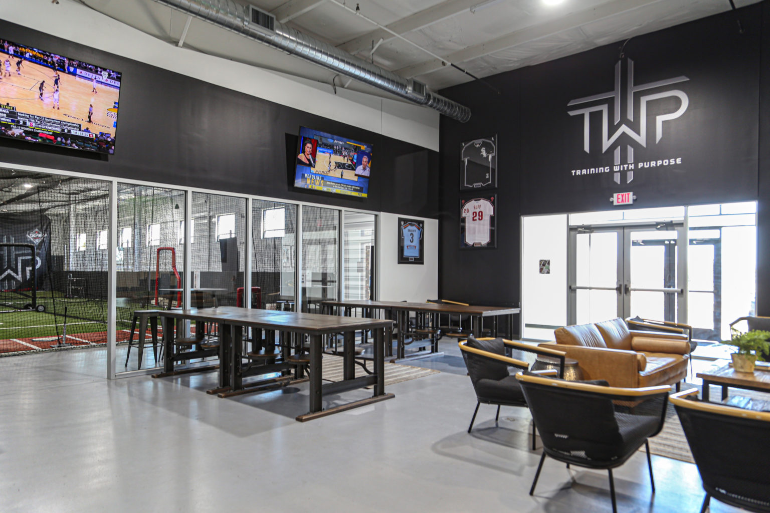 The Sports Armory interior featuring cafeteria tables from World Market